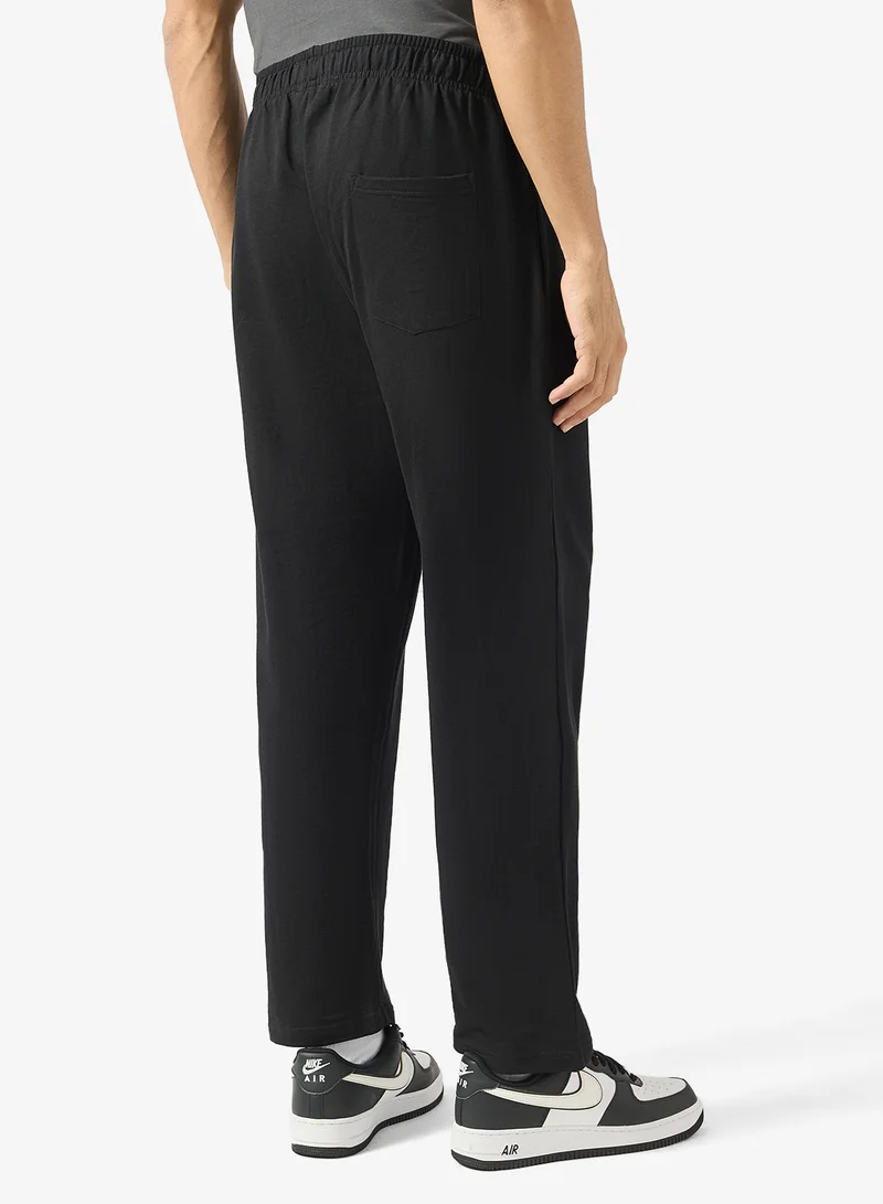 Seventy Five Black Text Print Relaxed Fit Joggers for Men | Best Price UAE