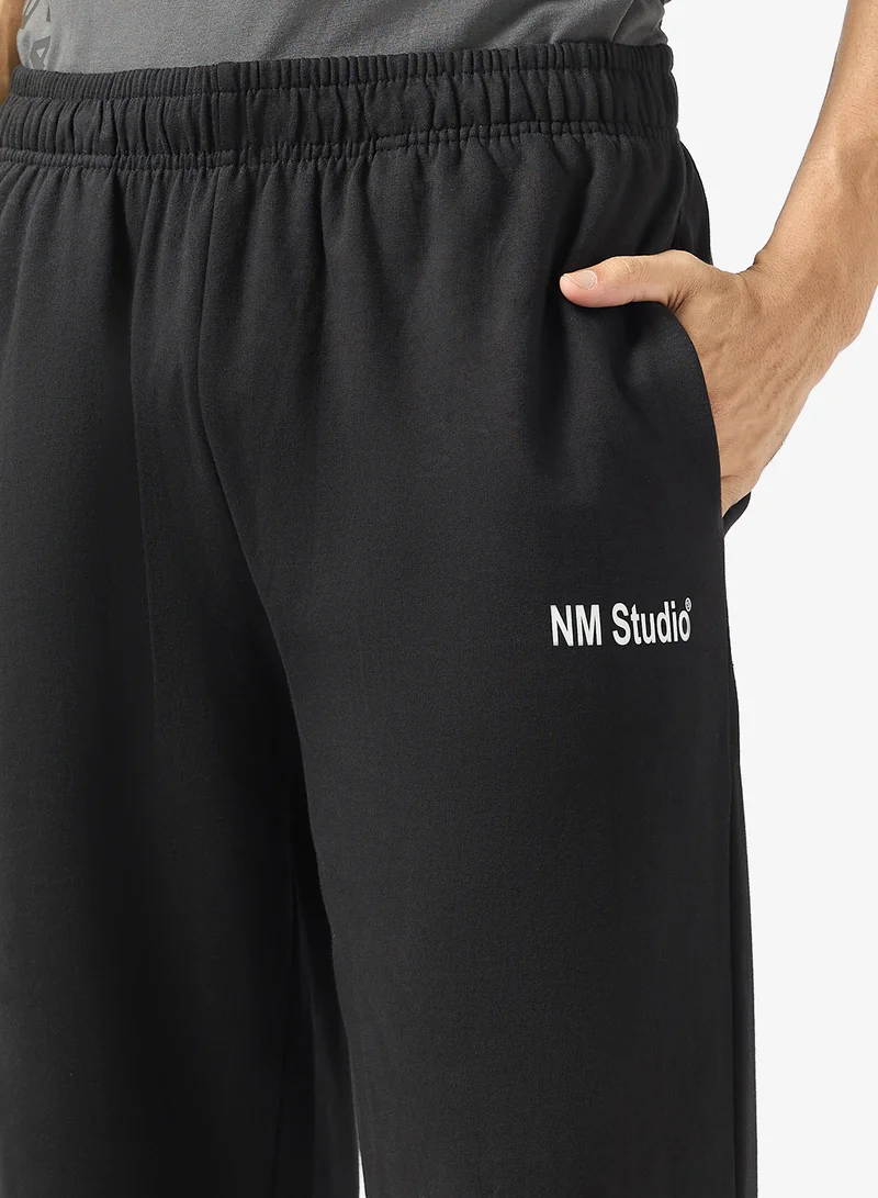Seventy Five Black Text Print Relaxed Fit Joggers for Men | Best Price UAE