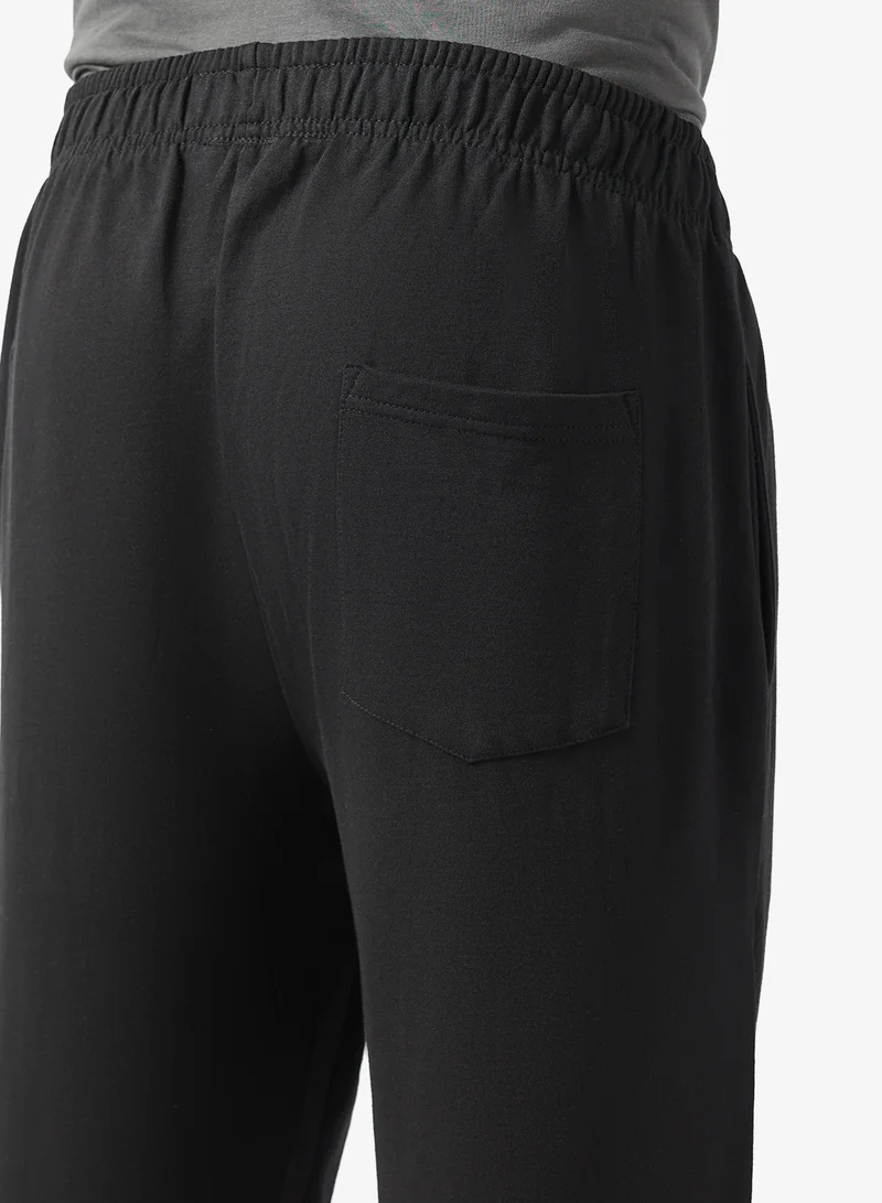 Seventy Five Black Text Print Relaxed Fit Joggers for Men | Best Price UAE