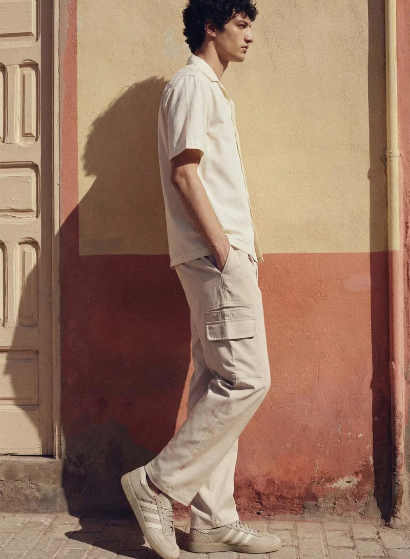 دينيس لينغو Cream Cotton Solid Full Cargo Relaxed Trouser For Men
