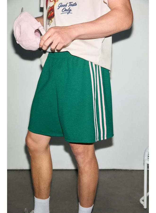 GRIMELANGE LARGO Men's Blue Relaxed Fit Contrast Banded Stretch Fabric Green Shorts.