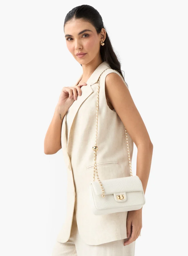 فلورا بيلا من شو إكسبرس Textured Crossbody Bag with Chain Strap and Twist Lock Closure