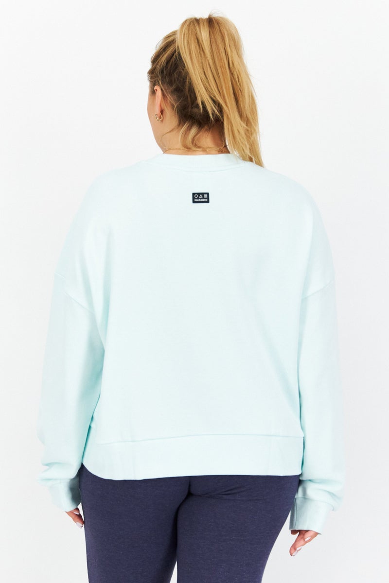 New Balance سترة نسائية واسعة المقاس بأكمام طويلة للأنشطة الخارجية، باللون الفيروزي - Image 2
