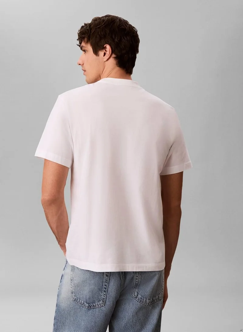 Calvin Klein Jeans Bright White Relaxed Embossed Logo T-shirt for Men | Best Price UAE
