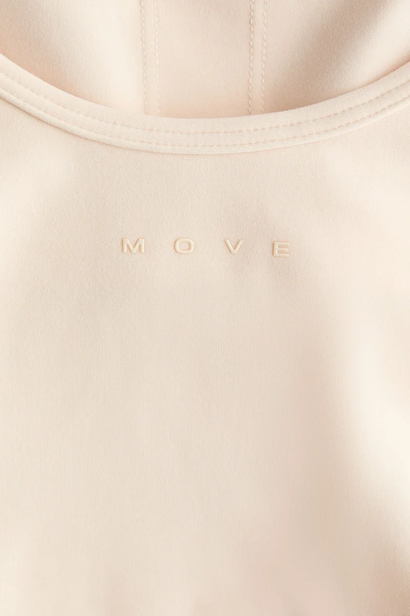 H&M Integral-bra sports strappy top with SoftMove™