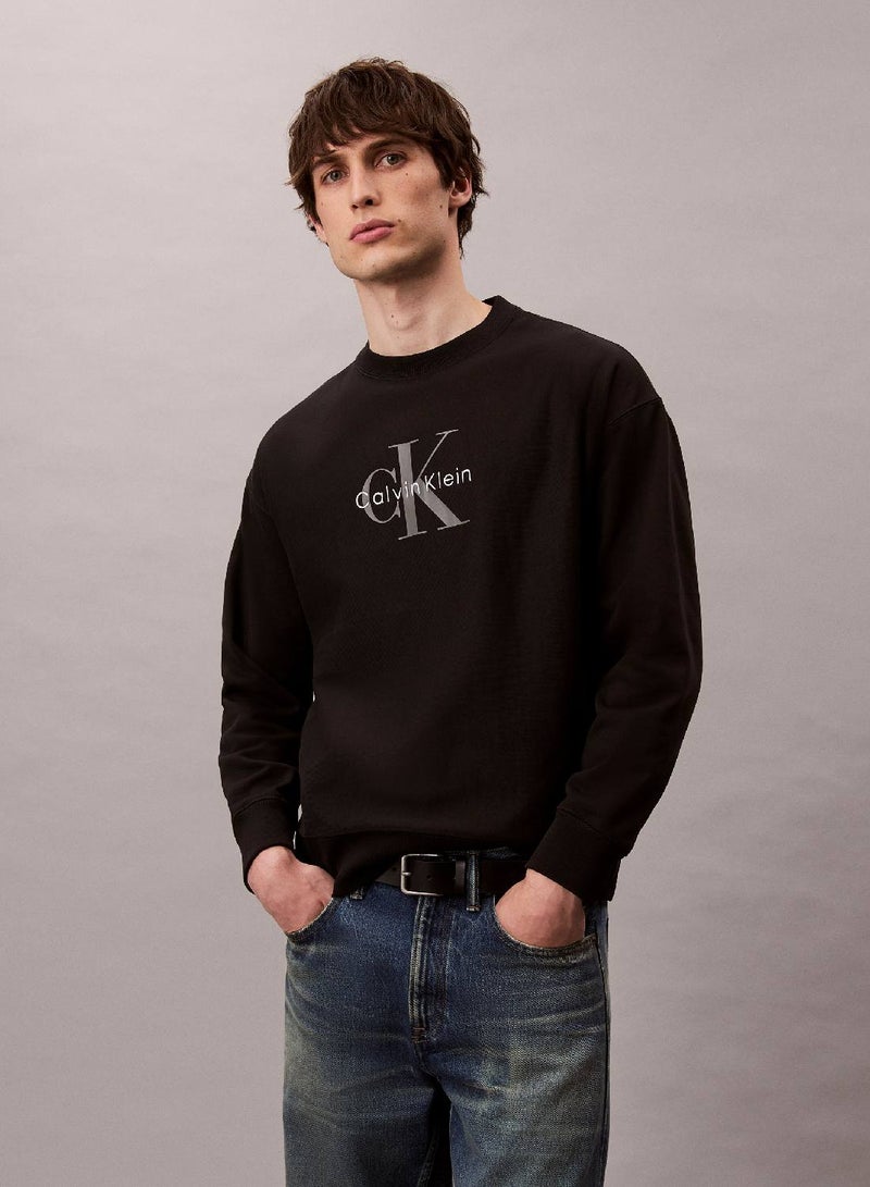 Calvin Klein Jeans سويت شيرت مريح بشعار مونوغرام تيري الفاخر - Image 1