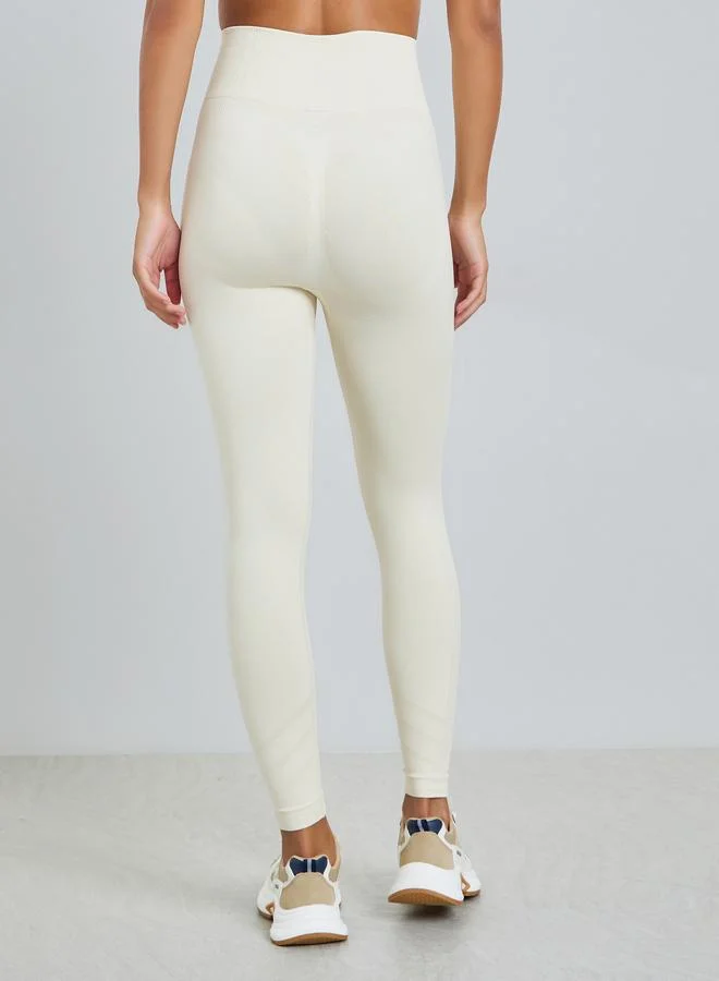 Styli Active Cream Cream Tonal Side Rib Panel Back Scrunch Leggings for Women | Best Price UAE