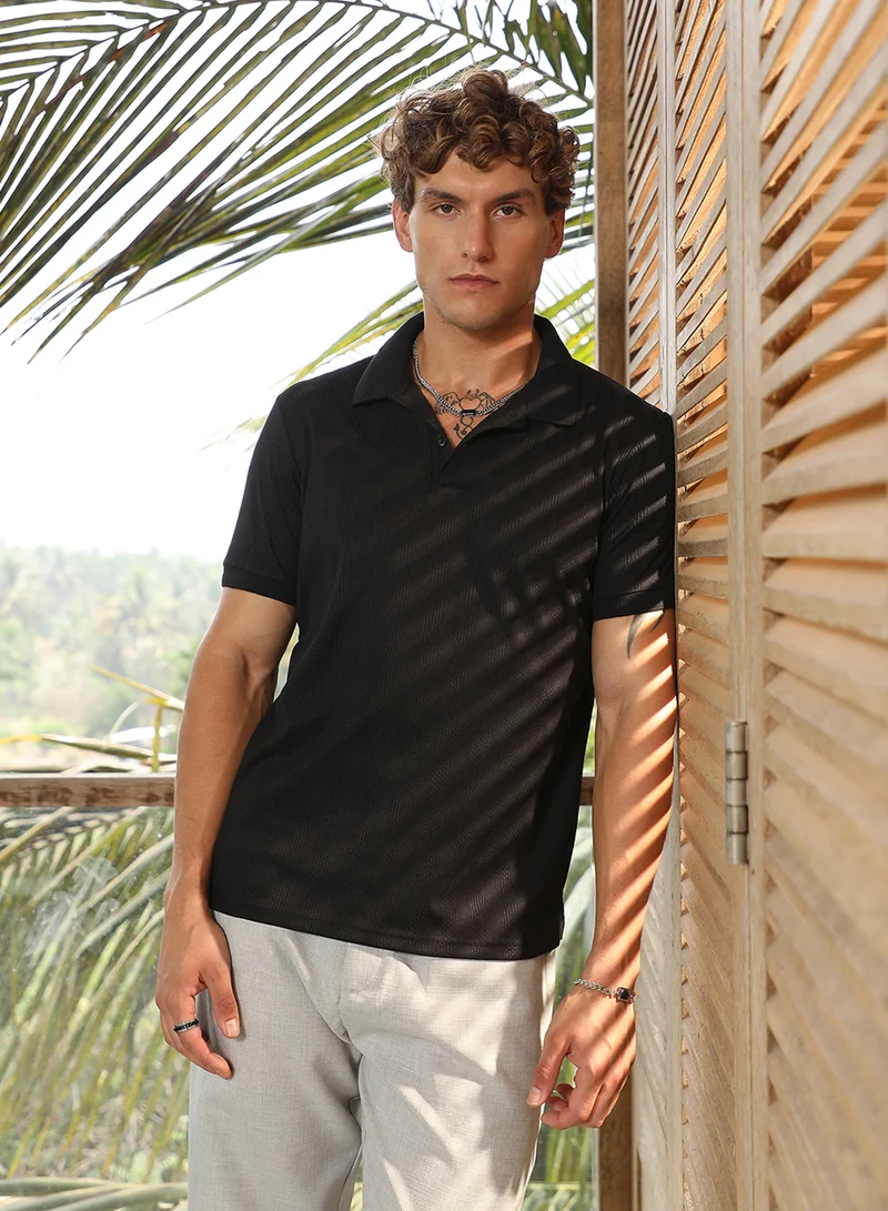 Campus Sutra Campus Sutra Men's Onyx Black Ribbed -Tactile Polo T-Shirt For Casual Wear | Polo Neck | Short Cuffed Sleeves | Half-Button Closure | T-Shirt Crafted With Comfort Fit For Everyday Wear