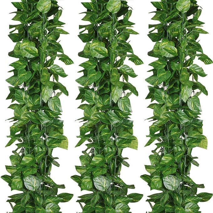 84 FEET ARTIFICIAL VINES GREENERY GARLAND FAKE HANGING LEAVES FAUX FOLIAGE PLANTS FOR WEDDING PARTY GARDEN HOME KITCHEN OFFICE WALL DECORATIONS SCINDAPSUS12 STRANDS
