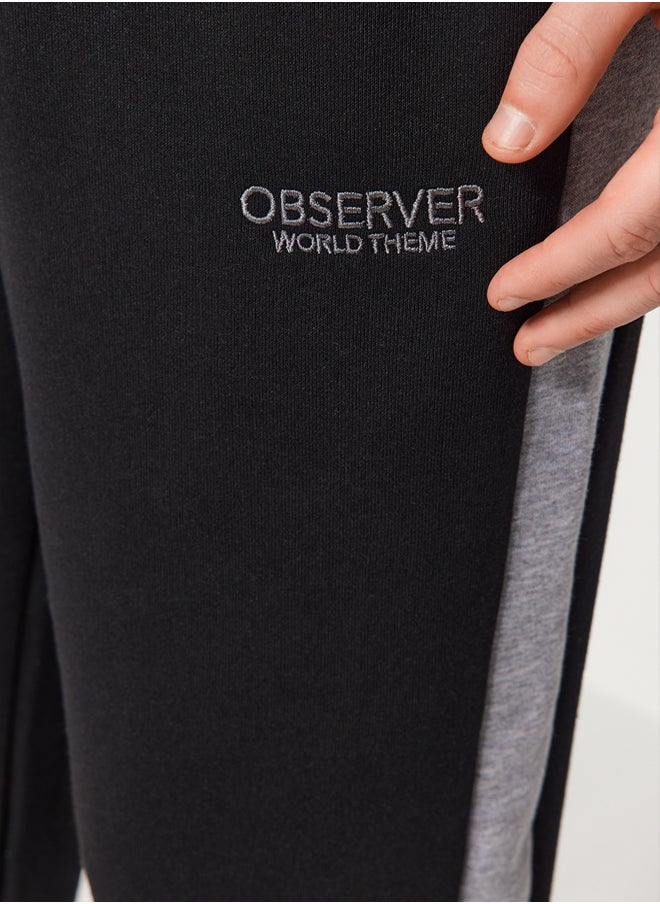 trendyol - Black Men's Regular/Regular Cut Contrast Color Paneled Bold Text with Embroidered Regular Leg Sweatpants. - Image 1