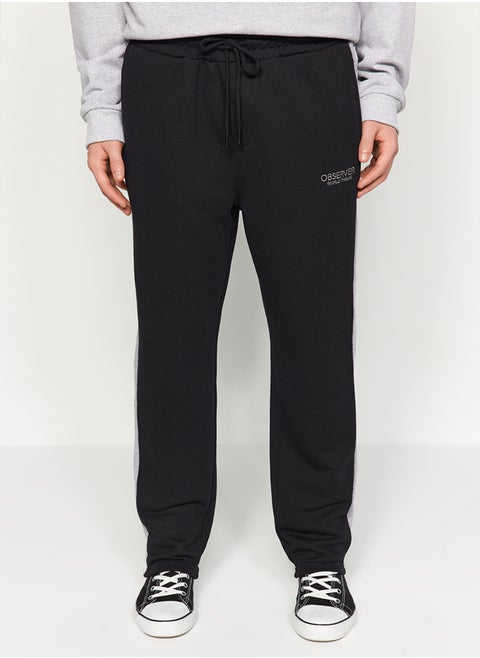 Black Men's Regular/Regular Cut Contrast Color Paneled Bold Text with Embroidered Regular Leg Sweatpants.