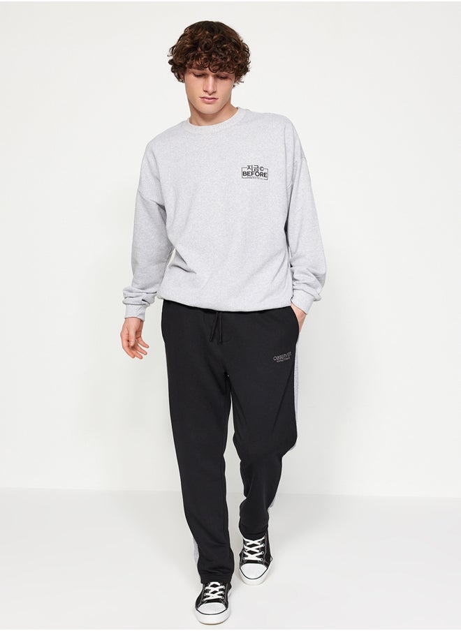 trendyol - Black Men's Regular/Regular Cut Contrast Color Paneled Bold Text with Embroidered Regular Leg Sweatpants. - Image 1