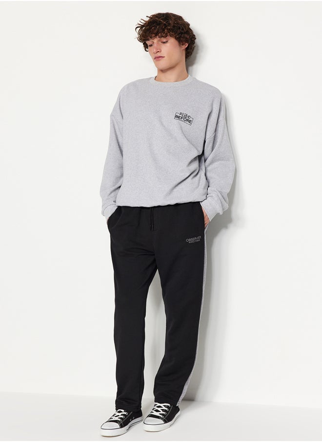 trendyol - Black Men's Regular/Regular Cut Contrast Color Paneled Bold Text with Embroidered Regular Leg Sweatpants. - Image 1