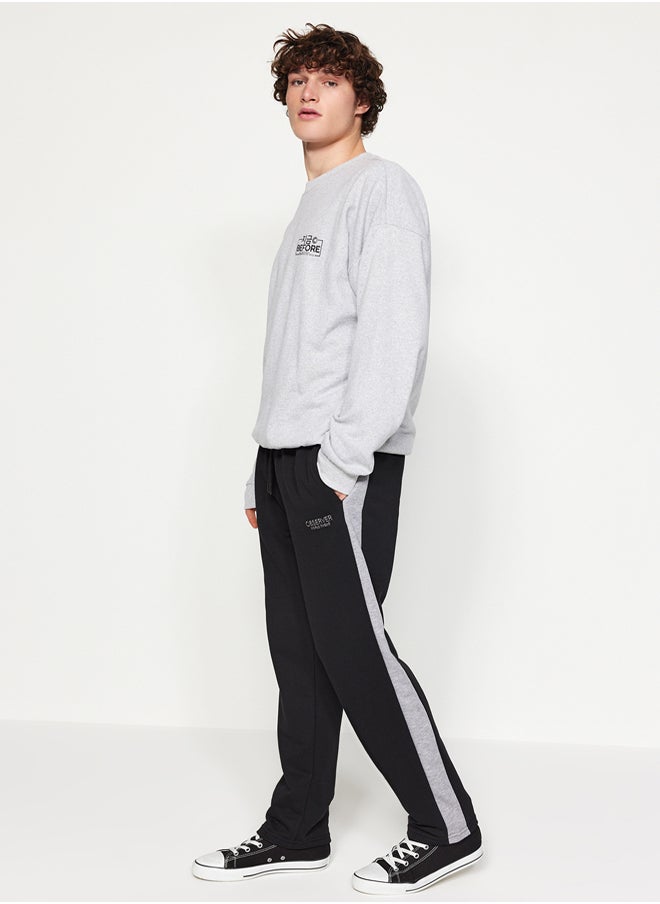 trendyol - Black Men's Regular/Regular Cut Contrast Color Paneled Bold Text with Embroidered Regular Leg Sweatpants. - Image 1