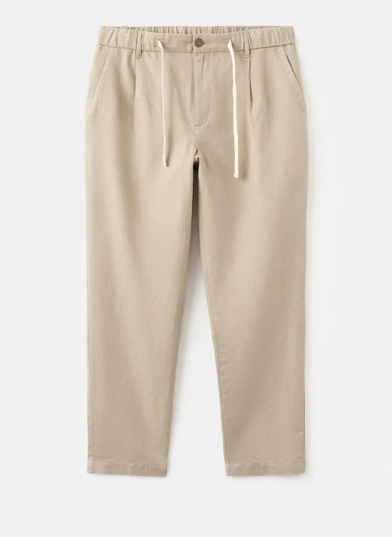 Mango Man  Slim fit cropped linen-cotton trousers for Men | Best Price UAE