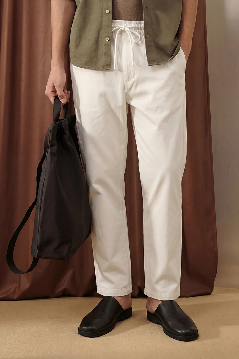 SNITCH Off White Solid Relaxed Casual Track Pants