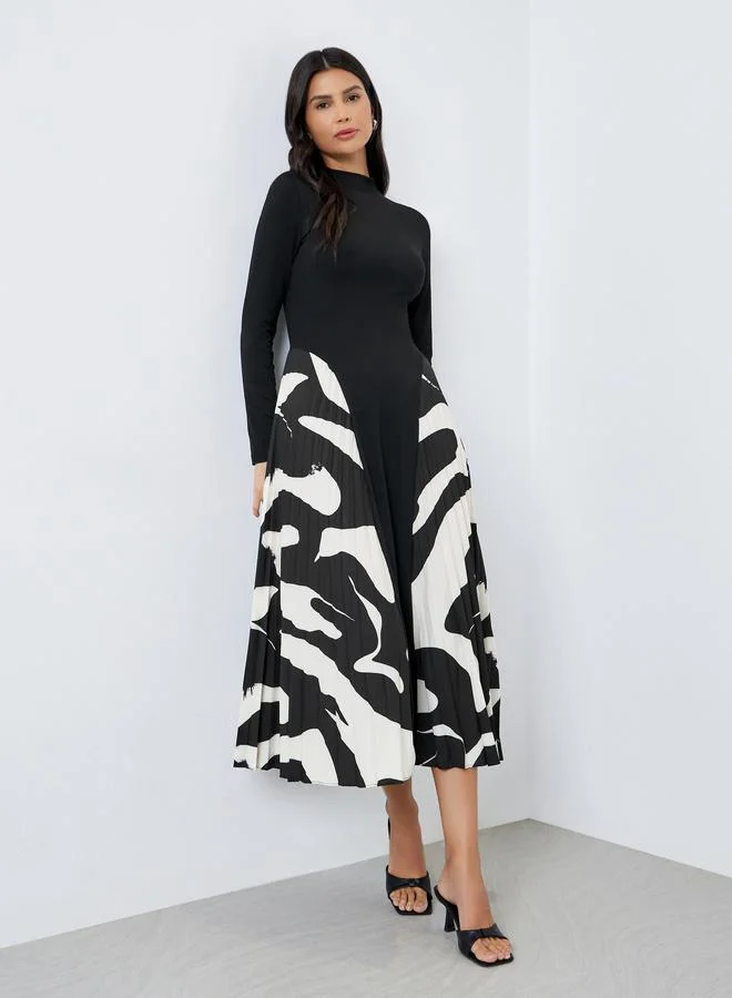 ستايلي فستان ميدي بتفاصيل كسرات