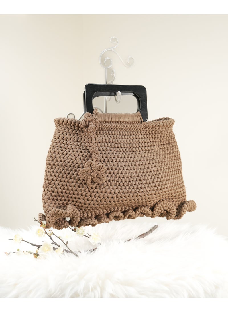 Brown Crochet Handbag with Flower Details, Ruffled Edge, and Black Square Handle