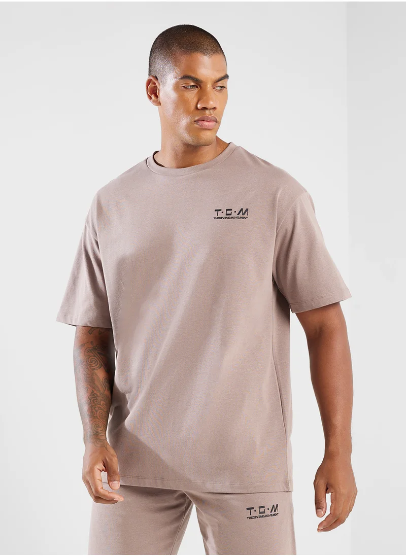 ذا جيفينج موفمنت Oversized Logo T-Shirt