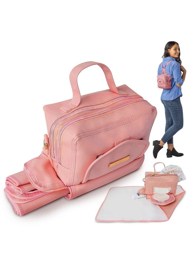 ChangePal Small Crossbody Diaper Changing Bag with Portable Baby Changing Pad, Front Wipes Pocket Opening, Shoulder & Stroller Straps Included (Pink Vegan Leather) - Image 1