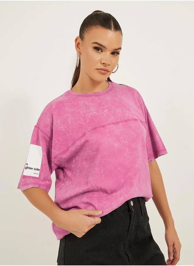 ستايلي Cotton Acid wash with slogan printed sleeve and flat lock stich Short Sleeve Oversized Round Neck Longline T-shirt 16