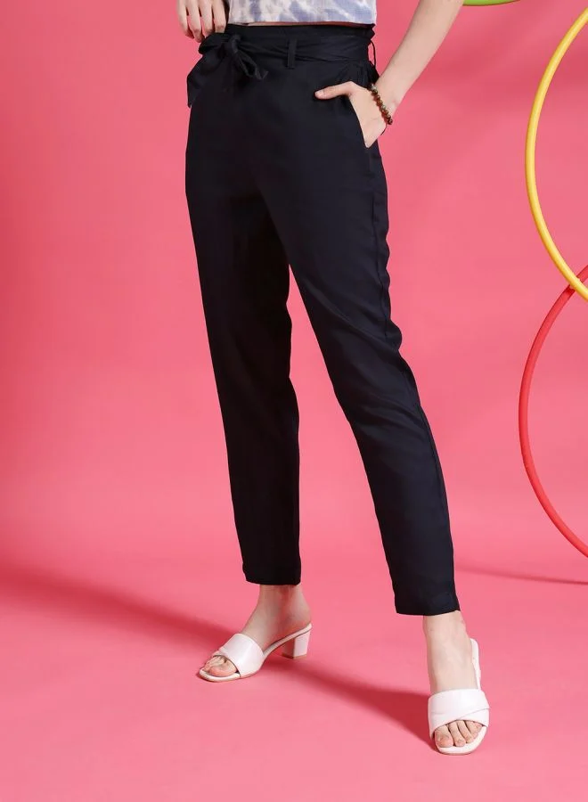 مرفوعة Women Tapered Solid High-Rise Pants
