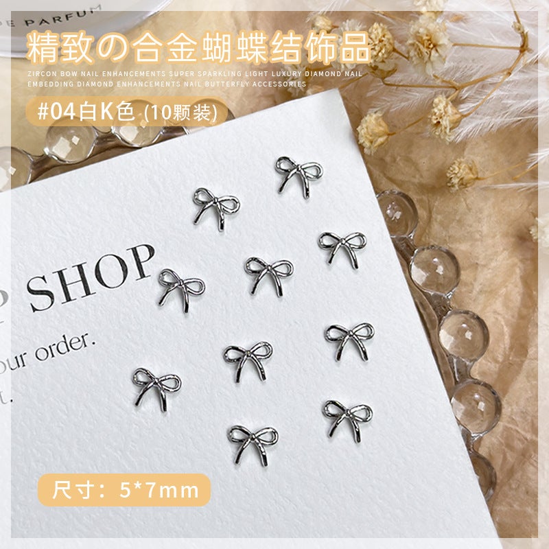 Alloy Bow Nail Ornaments 10 Net Red Explosions Gold And Silver Small Bow Tie Joker Christmas Nail Drill Accessories - Image 1