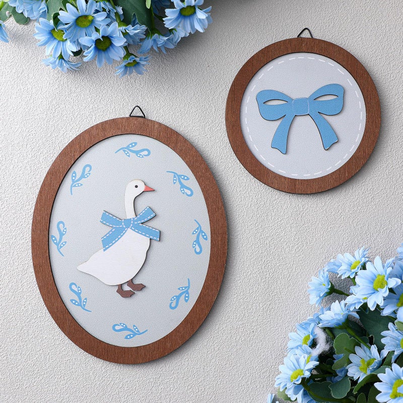 AceOrbit 2 Pcs Goose Nursery Decor, Wood Vintage Silly Goose Wall Art, Funny Duck with Blue Bow, Cute Duck Decor, Wooden Round Framed Wall Hanging Decoration for Nursery Baby Room Playroom Bedroom - Image 1