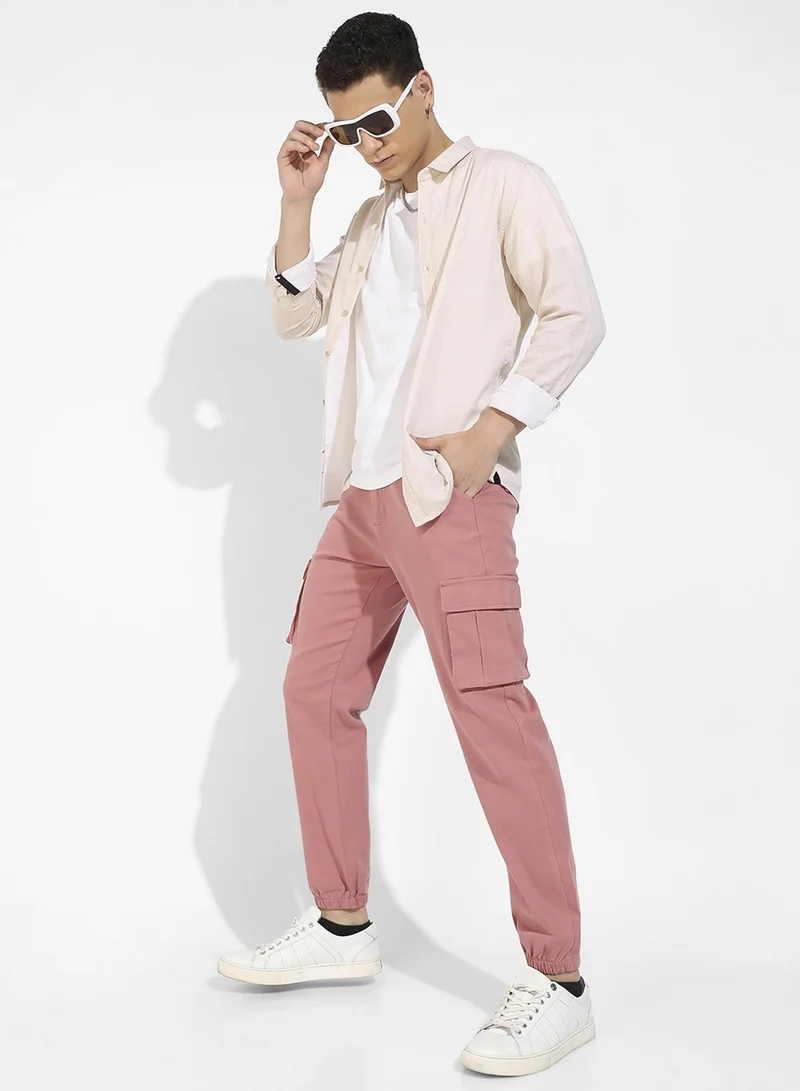 Campus Sutra Campus Sutra Men's Nude Pink Cuffed Hem Cargo Trousers For Casual Wear | 6 Pockets | Regular Fit | Button Closure | Cotton Poly Cargo Pant Crafted With Comfort Fit For Everyday Wear