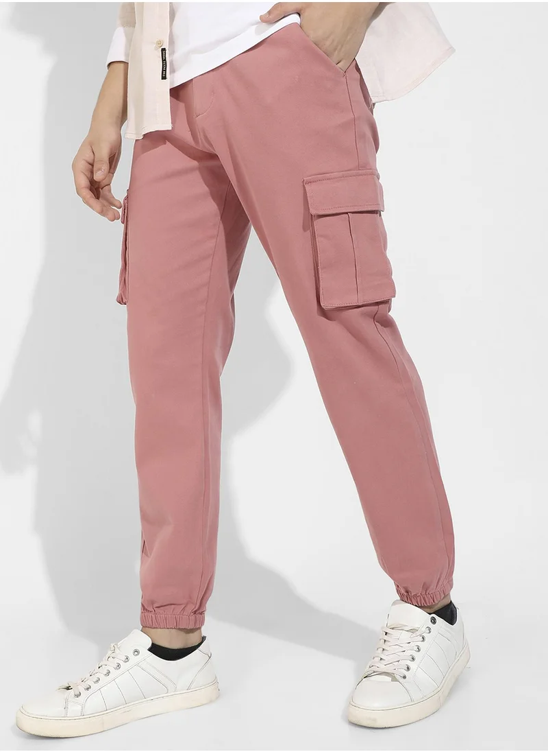 Campus Sutra Campus Sutra Men's Nude Pink Cuffed Hem Cargo Trousers For Casual Wear | 6 Pockets | Regular Fit | Button Closure | Cotton Poly Cargo Pant Crafted With Comfort Fit For Everyday Wear