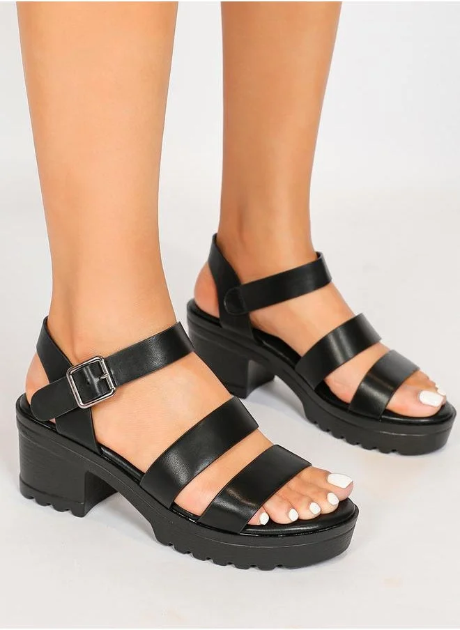 Sneak-a-Peek Solid Ankle Strap Block Heel Sandals by Styli