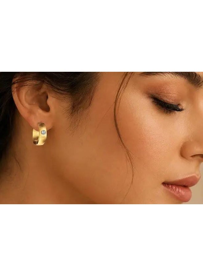 Luxuria Women's round, thick, gold-plated earrings featuring a sparkling zircon stone in the center. - Image 3