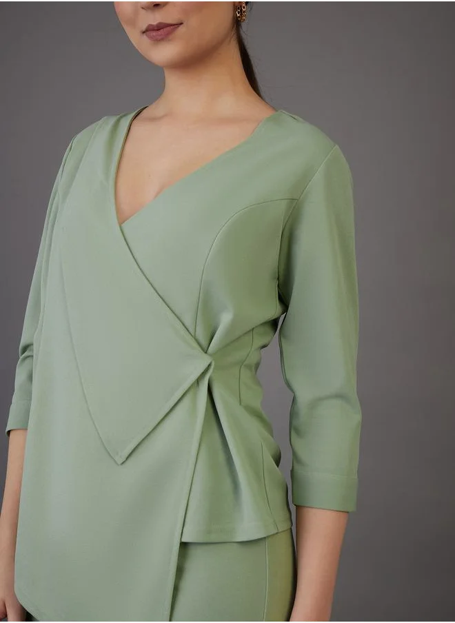 SASSAFRAS Asymmetrical Hem Wrap Top & Flared Pants Co-Ord by Styli