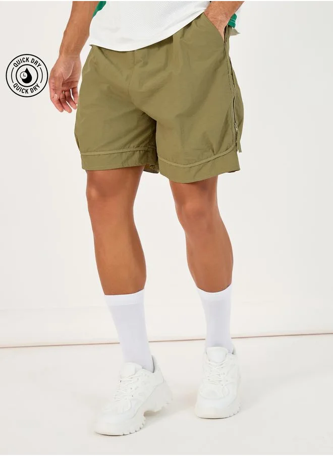 ستايلي 7inch Quick Dry Woven Shorts with Tape Hem & Zip Detail