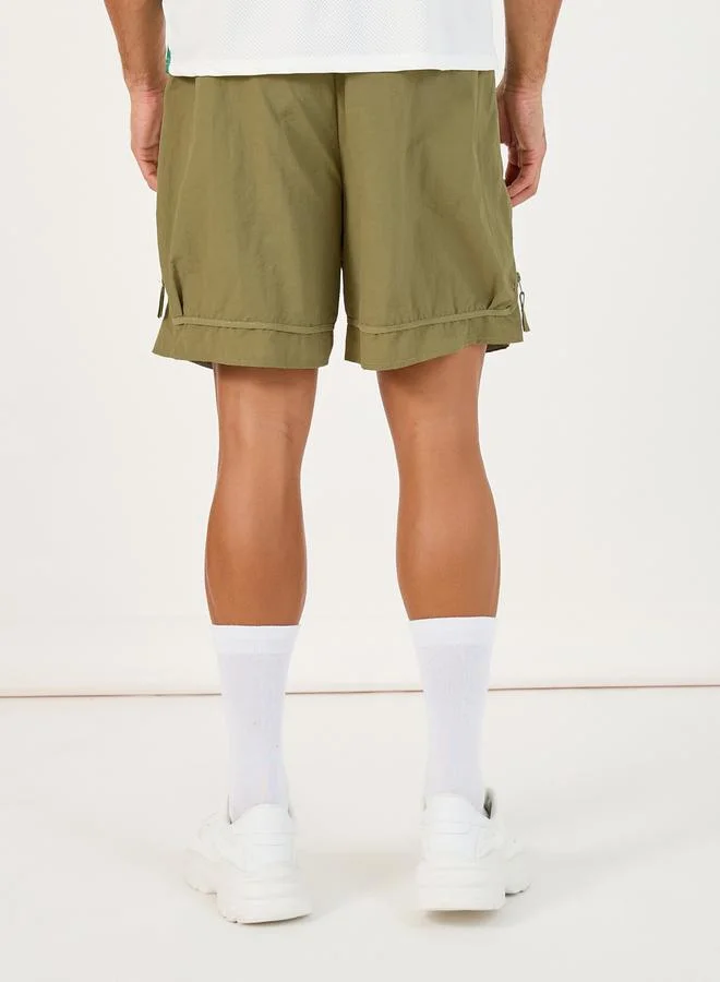 ستايلي 7inch Quick Dry Woven Shorts with Tape Hem & Zip Detail