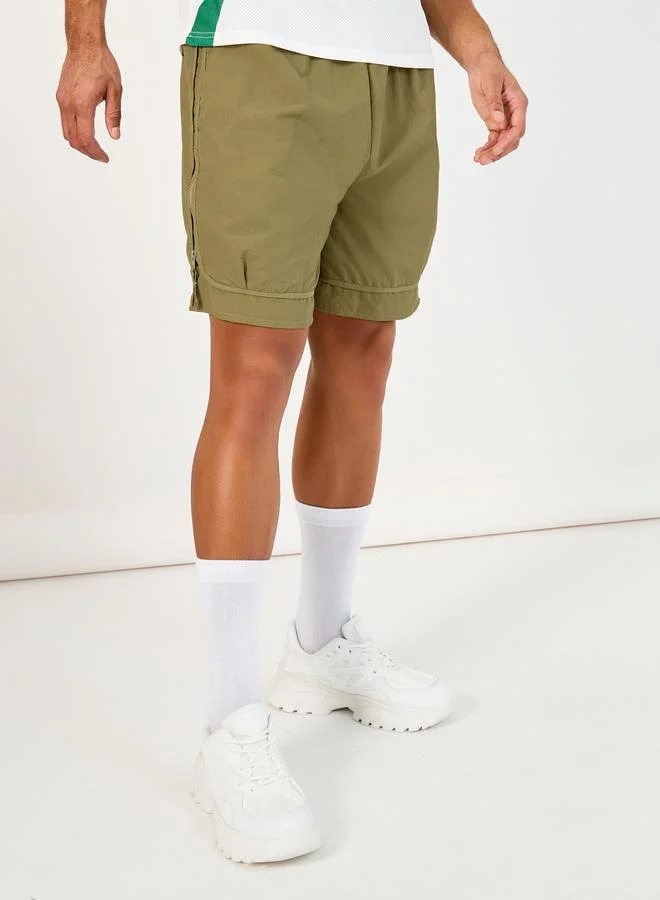 ستايلي 7inch Quick Dry Woven Shorts with Tape Hem & Zip Detail