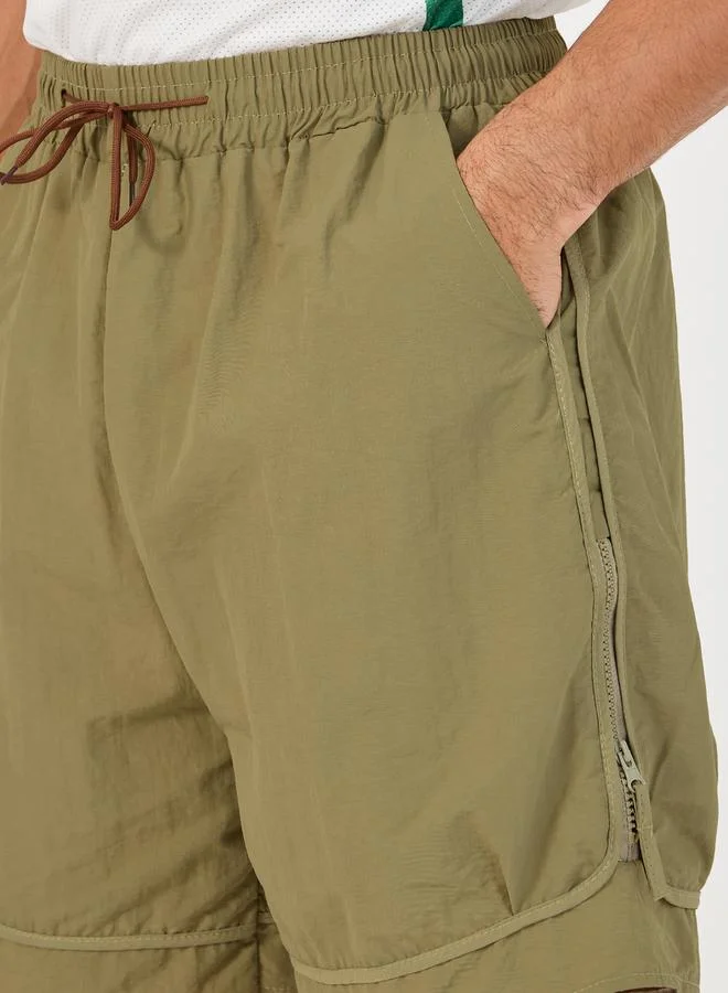 ستايلي 7inch Quick Dry Woven Shorts with Tape Hem & Zip Detail