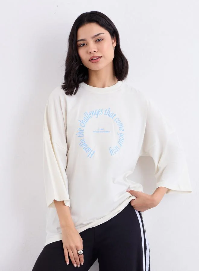 Styli Cream Oversized Slogan Print T-Shirt