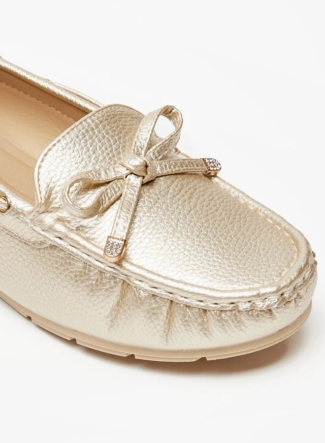 لو كونفورت Women's Textured Slip-On Loafers with Bow Accent