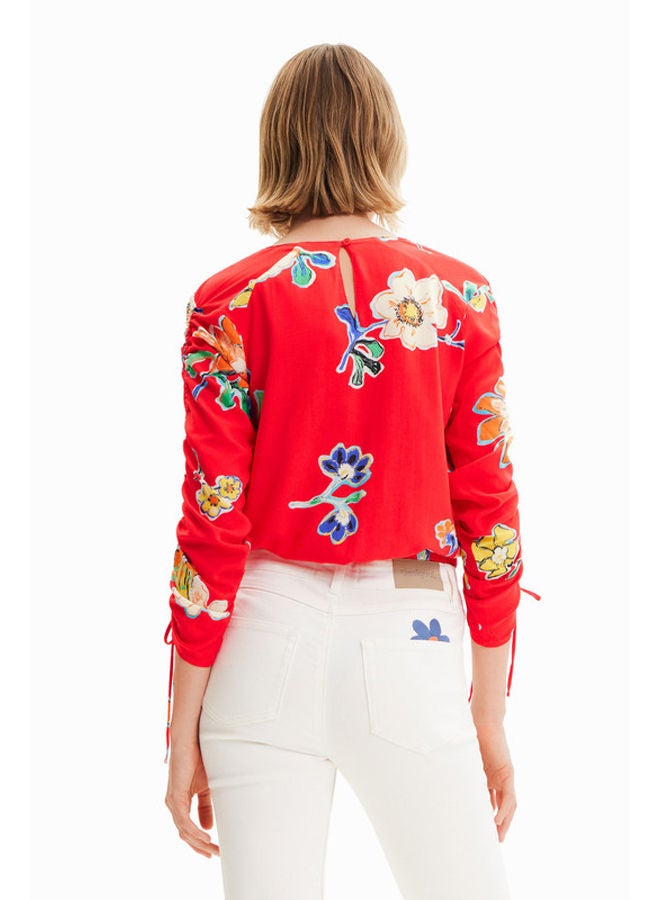 Short gathered floral blouse