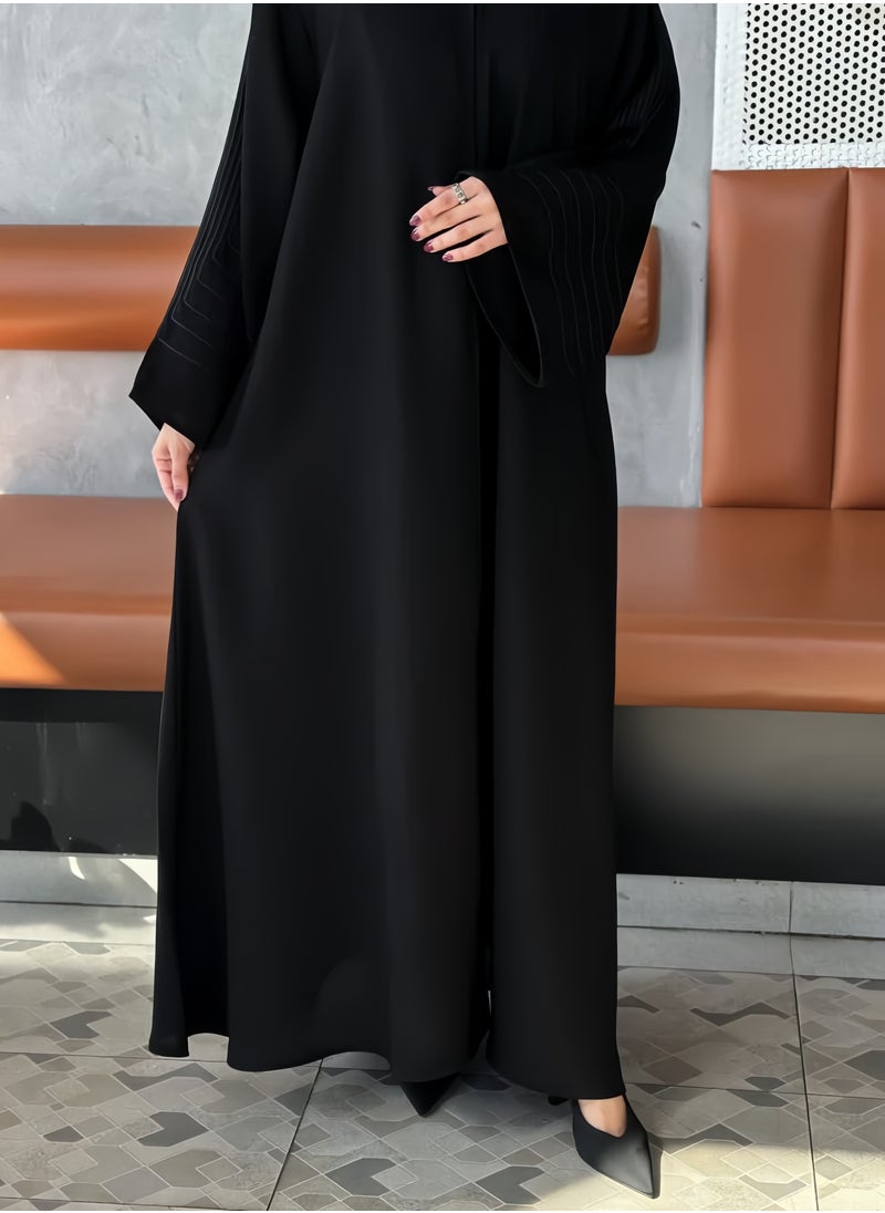 Saba abaya with elegant qitan detail offering a refined modest look with soft lines and a modern touch perfect for daily wear and simple occasions