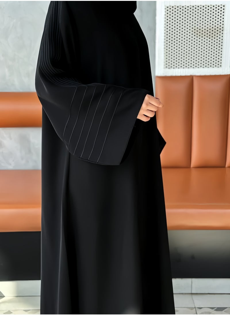 Saba abaya with elegant qitan detail offering a refined modest look with soft lines and a modern touch perfect for daily wear and simple occasions
