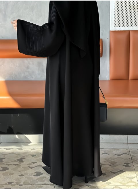 Saba abaya with elegant qitan detail offering a refined modest look with soft lines and a modern touch perfect for daily wear and simple occasions