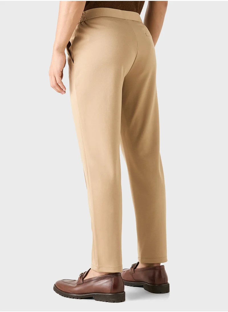 ايكونيك Iconic Solid Slim Fit Trousers with Pockets