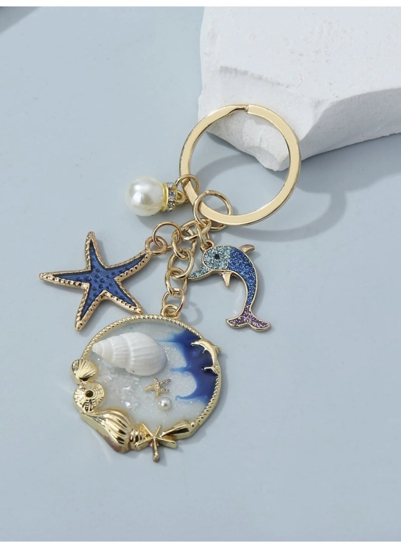 ڤيا ميدلية مفاتيح بوهمية بتصاميم بحرية — صدفة، نجمة بحر، دولفين وخَرَز لؤلؤي كيوت - Image 1