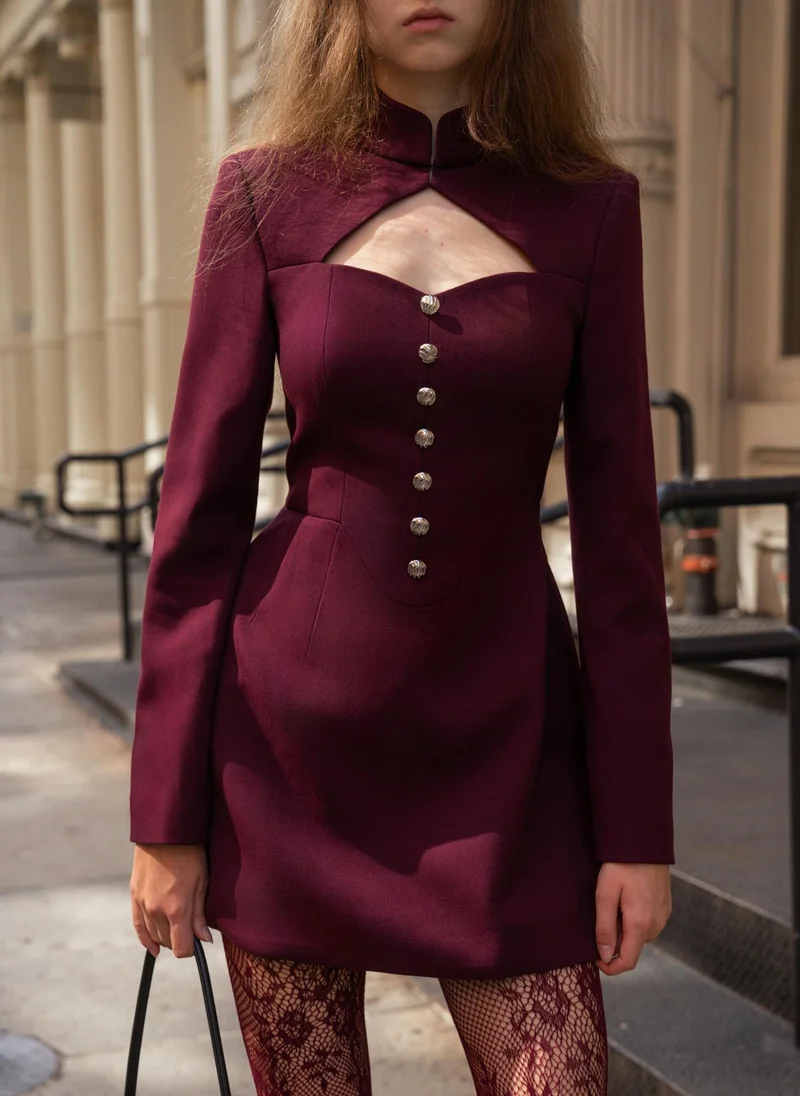 Mini dress with a cut-out at the chest and large buttons
