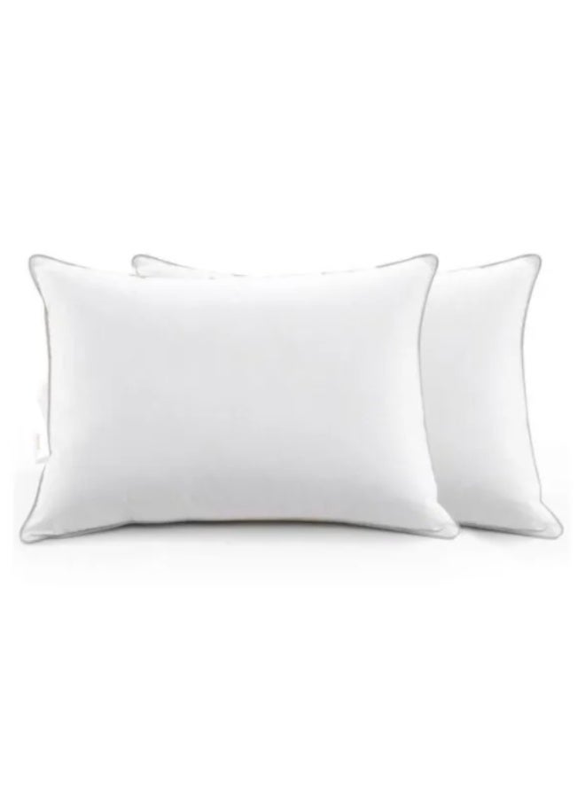 A microfiber pillow is filled with very fine synthetic fibers known as microfiber. It is characterized by its softness and lightness while providing comfortable support for the head and neck. It is often used as a practical alternative to feathers or natural down because it offers a fluffy and comfortable feel at a lower price and is easier to care for. - Image 5