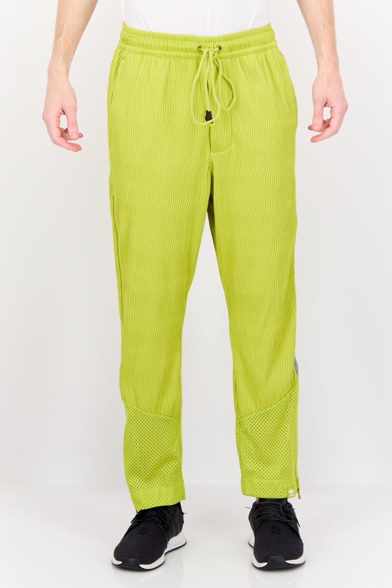 adidas Originals Men Sportswear Fit Outdoor Track Pants, Mustard Green - Image 1