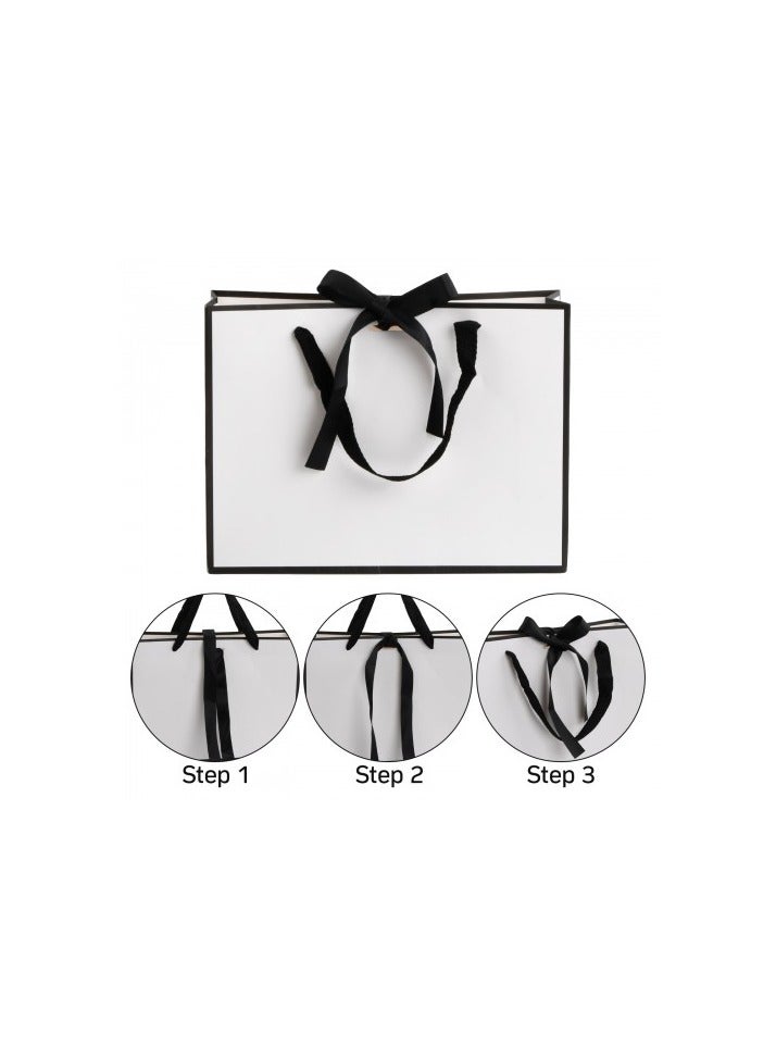 أكياس هدايا ورقية بمقابض، 6 أكياس هدايا متوسطة الحجم، 28 × 21 × 8 سم، أكياس هدايا أنيقة مغلفة بشريط فيونكة، أكياس هدايا مزخرفة لأعياد الميلاد وحفلات الزفاف والحفلات (أسود وأبيض) - Image 3