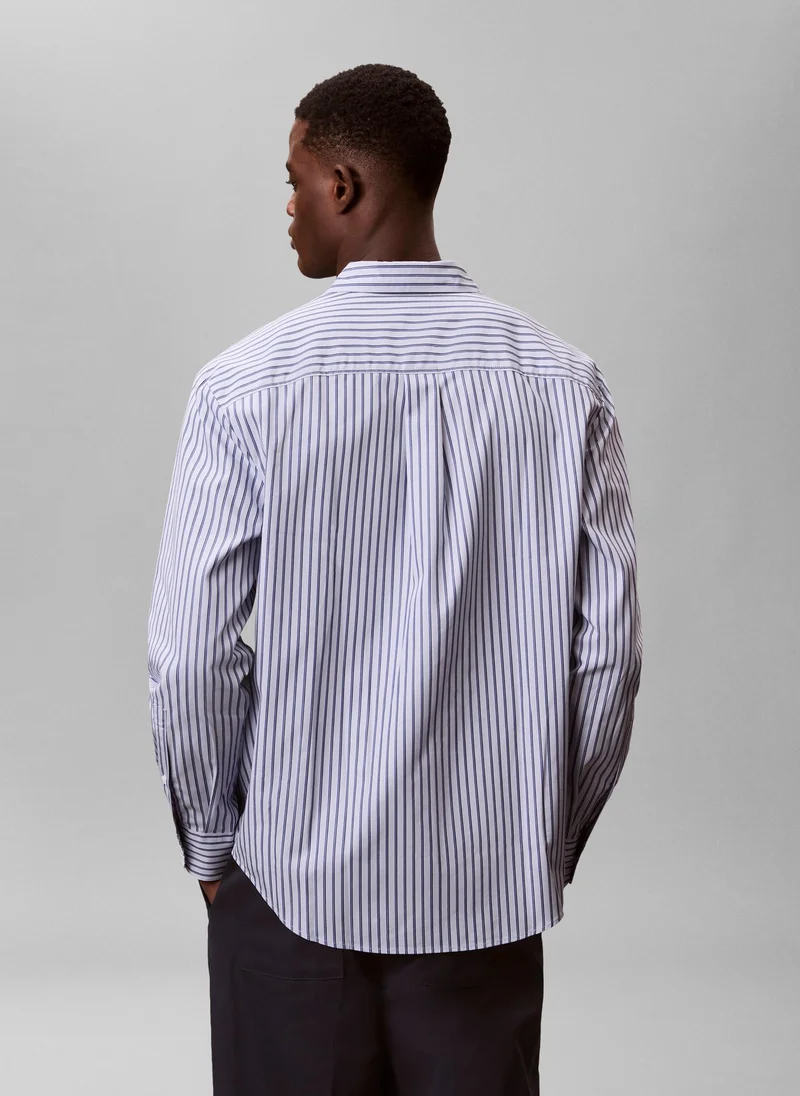 كالفن كلاين قميص قطني بأزرار مخطط مزدوج